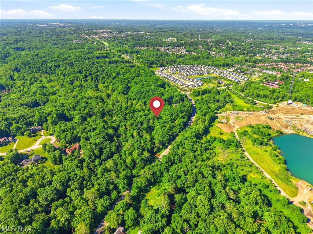 Rare 7.11-Acre Wooded Estate Parcel in Aurora Schools.

Discover the perfect setting for your custom dream home on 7.11 beautiful, wooded acres in the award-winning Aurora City School District. Offering exceptional road frontage along N. Chillicothe Road, this rare parcel combines privacy, natural beauty, and convenience in one of Northeast Ohio's most desirable communities. Imagine winding through your own wooded landscape to a secluded homesite surrounded by mature trees and abundant wildlife. With over 7 acres to work with, there's room to create the estate you've always envisioned—whether that's a luxury residence, outdoor living spaces, gardens, recreational trails, or simply the peace and quiet that only acreage can provide. Ideally located just minutes from Aurora Farms Premium Outlets, Barrington Golf Club, parks, dining, and major commuter routes, this property offers the best of both worlds: a private retreat
with everyday conveniences nearby. Opportunities to purchase large acreage parcels in Aurora are increasingly rare. Bring your builder, bring your vision, and make this exceptional property your own.
7.11 Wooded Acres • Aurora City Schools • Extensive Frontage on N. Chillicothe Rd • Private
Estate Setting • Convenient Access to Shopping, Dining & Recreation