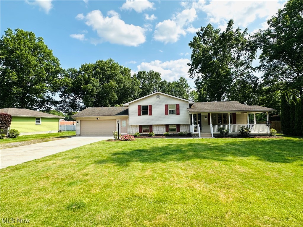 Brand NEW Roof w/30 year warranty for the new buyer! Last deal went bad due to NO fault of the sellers hence the days on the market.There is nothing wrong w/this amazing Mineral Ridge home! You want to live in Ridge but you need an entire mother-in-law suite on the main floor & can’t find one? Look no further than this 4 bedroom, 3 FULL bath split level w/a huge addition on the back that gives you 2,899 ft.² of total living space! The second you pull in your newer concrete driveway you’ll love the "POP" that your fresh landscaping & curb appeal offers leading right to your oversized front patio that already has your porch swing ready for your morning coffees! Your 2nd patio is made of Trex decking & is privately located off your rear addition which has great views of the woods & backyard area! WAIT UNTIL YOU SEE THIS KITCHEN!! You're going to love your oversized updated chefs kitchen that has newer stainless appliances, & custom maple cabinets ON ALL 3 WALLS w/a HUGE island that can house every cooking utensil you could ever dream of! You get to conveniently inherit all of the years of meticulous updating & perfect maintenance that the sellers have done like your new wide plank, real hard wood floors that lead from your formal dining room & extend throughout the entire 2nd level! Your additional 3 bedrooms are on the 2nd floor w/a 3rd full en-suite bathroom that is connected to your Master! Your open lower level has your 3rd full bathroom & could be used for a theatre room, pool table room, or even made into a 5th bedroom if needed! Your new home has a convenient side driveway which is perfect for RV parking, boat storage, or extended family multiple cars. etc. Dad will love his oversized shed/workshop in the back yard that is double the size of a normal shed & can fit every tool or toy that you could possibly have. Your 4th level basement area is already partially finished, has a bonus room, laundry room, & could easily house a 5th bedroom! Book your showing TODAY!