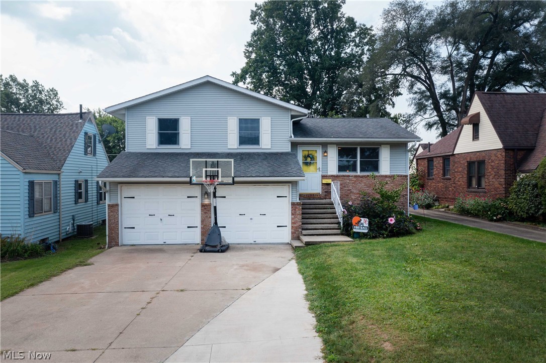 What a rare find this beautifully renovated home located in a quaint established neighborhood. As you enter you're greeted by high vaulted ceilings and a dreamy skylight that provides abundant natural lighting. The large kitchen (6x4) island and breakfast bar have been amazingly renovated with multi-tone granite countertops accented by subway tile, stainless sink, and cabinetry galore.  Walkout to a deck and private backyard that is completely fenced with additional patio space for those cool September evening fires!  The lower level provides a cozy great room that features a full bath and accessed to the rear yard.  Within walking distance to shopping and restaurants and easy access to freeways, this home is full of current amenities that are found in much newer and higher-priced homes.  The neutral décor and wonderful layout are ready for its new owner to move in and begin their life at this fabulous home.