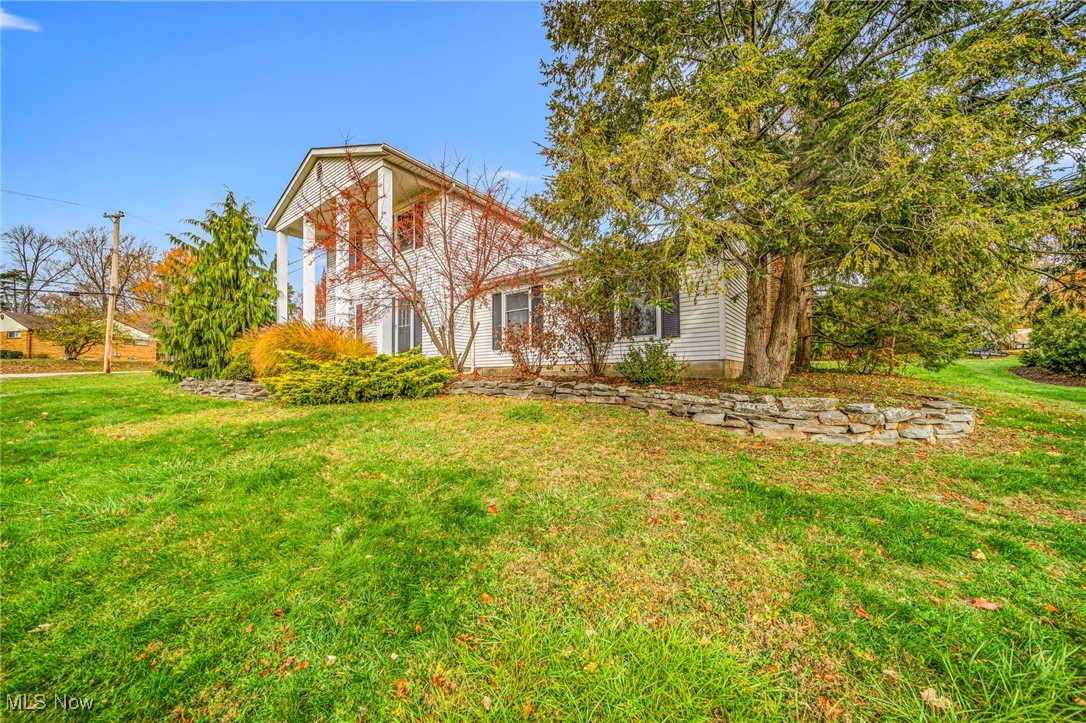 Welcome to Paradise, where modern updates meet timeless Colonial charm. This spacious 4-bedroom, 3-full-bath home offers just over 2,200 sq ft of beautifully remodeled living space. An updated kitchen, fresh flooring, plush new carpet, and warm recessed lighting that creates great light throughout the Home. Every major improvement has already been taken care of for you—brand-new furnace, hot water tank, electrical panel, and windows, all installed in 2025, Each bedroom features a ceiling fan, and the thoughtful updates. Overlook a scenic view of the Metro Parks, also near the Painesville Country Club and Riverside High School. A large back deck is perfect for outdoor gatherings, on a huge almost 1 acre corner lot. Move-in ready and meticulously maintained, Paradise is the perfect blend of style, comfort, and modern convenience.