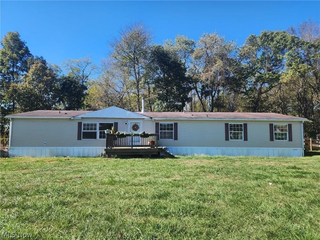 Welcome to this spacious four-bedroom, three-bath home privately nestled on a peaceful 2.08-acre mini farm that was once part of historic Lake Marwin. The oversized master bedroom features his-and-her closets, while the master bath includes a corner tub, separate shower, and dual sink areas. Attached is a flex space ideal for a nursery, office, study, or pantry. The living room, dining room, and kitchen offer an open-concept layout perfect for entertaining. All appliances stay, including two refrigerators, a two-year-old stove, dishwasher, washer, and dryer. The air conditioner is one year old, and the wood-burning stove was installed in 2024. The property borders a farmer’s field and acres of untouched nature. Although the road is township-maintained, the setting feels extremely private. As you crest the knoll, you are welcomed by a lush, golf course-like lawn (seasonal). Beyond that sits the well-maintained 2004 manufactured home offering approximately 2,500 square feet of living space. The home was hurricane-strapped to a professionally poured six-inch concrete pad in 2020. Three stone-lined fire pits provide the perfect place to relax and enjoy the sunsets. The propane tank is tucked beside a secure chicken coop that comfortably houses ducks, chickens, and turkeys. The property also features a pasture area with a wired small barn. Two additional concrete pads are located on the property. One is currently used for livestock but could be converted back into a single-wide trailer site, as plumbing and electric remain in place. The third pad is wired and plumbed for a camp rental, single-wide trailer, or small home for extended family. A governor’s driveway leads to a massive metal barn with a concrete floor and two separate 220-amp electric hookups. Currently used as a welding shop and storage space, it is large enough for boats, vehicles, motorsports equipment, and farming equipment. Additional updates include new electric service and two county water hookups.