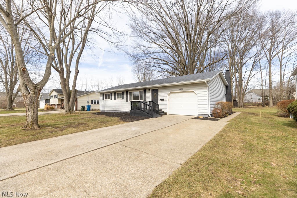 Welcome to 36470 Aurensen Rd. in North Ridgeville. This beautifully renovated home that sits on 1/2 of an acre is ready for it's next owner. Head in through the front door and you will notice the neutral paint colors and flooring throughout as well as the natural light coming in through the large bay window in the living room. This leads to the large open concept kitchen with breakfast bar that features plenty of cabinet space with quartz counters, backsplash and new stainless steel appliances. Off of the kitchen is the great room with fireplace that opens to the large backyard with concrete patio. The first floor has 3 bedrooms and nicely renovated bathroom with tiled backsplash. The finished portion of the basement which adds a little over 600 square feet of additional living space leads to the large utility room that has a newer hot water tank from 10/25 as well as the furnace which was updated with a new condenser and igniter in 10/2025. Call today to schedule your tour to see all that this wonderful home has to offer!