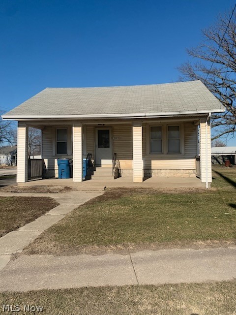 Step into the charm of this inviting 3 bed, 1.5 bath home, complete with a covered front porch perfect for relaxing, a fully fenced yard, and a detached garage that adds storage and versatility. Inside, you'll find a comfortable, easy-flow layout with room to make it your own, plus a basement for extra storage or future possibilities. Located in a great walkable area, you're close to everyday conveniences and neighborhood spots. Come make this your home, it's ready to welcome you in!