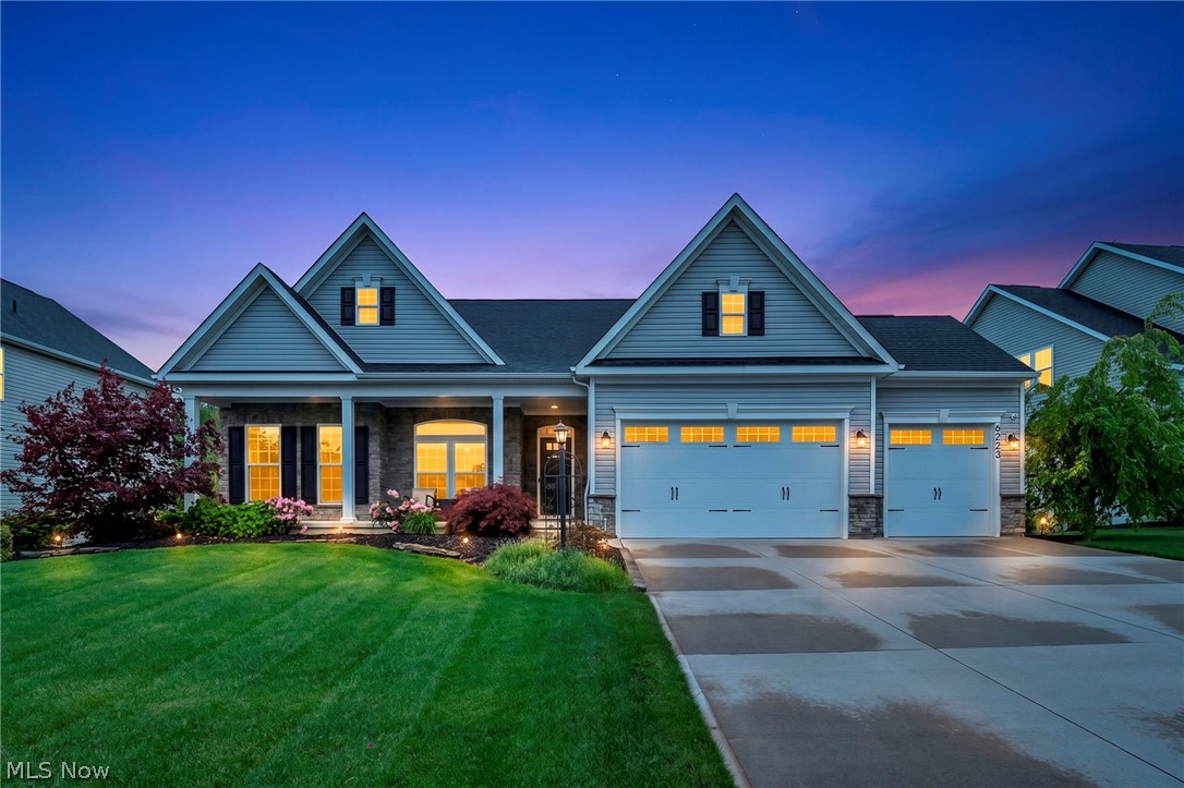 Welcome to this beautifully upgraded ranch in the highly desirable Dover Highlands subdivision on Medina’s south side in Lafayette Township — hello, no city taxes! This home combines luxury finishes, thoughtful design, and resort-style outdoor living in one unforgettable package. From the moment you arrive, the curb appeal sets the tone with professional landscaping, a welcoming covered front porch, and a 3-car garage complete with epoxy flooring. Inside, soaring 9-foot ceilings, natural light, rich flooring, and a coffered ceiling create an open and inviting feel throughout the main living space. The electric fireplace with shiplap and custom mantle serves as the perfect focal point. Walls of windows showcase peaceful backyard views. The kitchen was designed with soft-close cabinetry, granite countertops, a large center island, and seamless flow into the dining and living areas. The mudroom entry offers custom built-ins for added convenience and organization, and the first-floor laundry room makes day-to-day living easy. The owner’s suite feels like a private retreat with a tray ceiling, spacious walk-in closet, dual vanity sinks, and a large walk-in shower. A private glass door with sliding screen leads directly from the bedroom onto the elevated Trex deck overlooking the backyard and pool. The second main-level bedroom is currently being used as a home office, offering flexibility. The finished lower level expands your flex space with a massive recreation area, custom accent wall, beverage fridge and serving counter, workout room, third bedroom, full bath, and generous unfinished storage space with built-in shelving. The backyard is the showstopper, featuring an elevated Trex deck with remote-controlled retractable screens, expansive stamped concrete patio, powered shed, sprinkler system, and heated 12x24 chlorine recessed pool surrounded by peaceful nature views and no direct backyard neighbors. Don't miss this! Call Today!