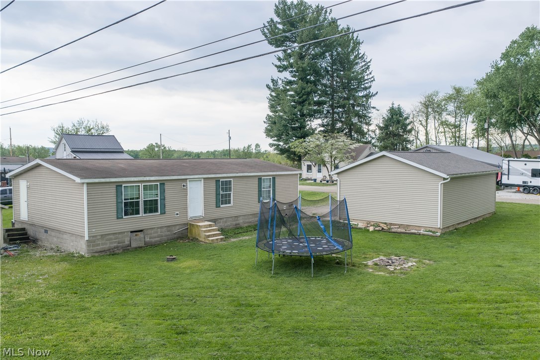 Currently tenant-occupied and generating $1,195 per month. This mobile/manufactured home offers convenient one-floor living just outside of town and serves as an excellent investment property. 3-bedroom, 2 full baths, a nice-sized kitchen, dining room, and laundry room, all on one level. The 2-car garage provides great storage and parking options. Schedule a private showing today.