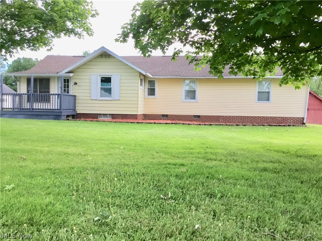 A great home with lots of room to grow, both inside and out. This 3 bedroom ranch sits on 1.2980 acres of land on the edge of Columbiana County. The ceramic tiled entry way leads into a newly refinished living room with a vaulted ceiling and arched picture window.  The master bedroom has a full bath as well as a spacious walk in closet.  New Kraftmaid cabinets have been installed in the kitchen.  There are full length closets in both the smaller bedrooms as well as a full length closet in the mail hall.  All of the rooms have been repainted.  The basement contains a partially finished 26 x 14.5 family room with fireplace and outside access that has limitless possibilities.  Breezeway and Carport in rear of house.  Roof  2012.  Furnace and electric November 2017. Seller providing Home Warranty. Well and septic inspections are done and have passed.
