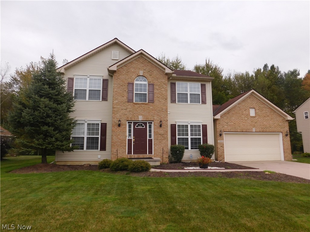 Welcome to Avalon Estates on the border of North Ridgville and Avon. Built in 2006, with over 3000 sqft, well maintained Center Hall Colonial 2200 sqft on the first and second floors with 4 bedrms, 3.5 baths and SMART features. The lower level with 1100 sqft is mostly finished ready for your custom touch. The open floor plan situated on a stunning prime lot backing to wooded landscape. The first floor welcomes you to a spacious foyer, Den with french doors, formal living room with beautiful natural lighting. Continue on to the gathering place, the family room w/ recessed lighting & gas fireplace. The eat-n kitchen offers 42" cabinets, mosaic back-splash, pantry & breakfast bar. The Sunroom doubles as a dining area surrounded by walls of windows and sliding glass doors leading to the patio and back yard plus a irrigation (sprinkler) system w/ programmable multiple zones keeping you yard beautiful The mud room to the garage is a 1st floor laundry. The 2nd floor hosts 4 spacious bedrooms
