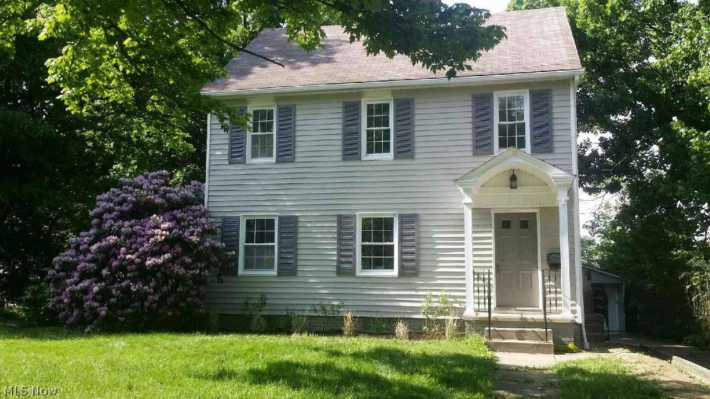 Nice sized Colonial in Cuyahoga Falls City School District!  Lots of historic character.  Updates throughout.  Neutrally decorated.  Three nice sized Bedrooms plus a huge third floor Living Space/Master Bedroom.  Two Full Baths.  Spacious Living Room with large windows and fireplace.  Larger centrally located Kitchen features stainless appliances, tile floor and back splash, and new countertops.  New flooring, Kitchen, newer windows and lighting, updated Baths, plus more throughout the house.  Large Basement with potential.  The yard is perfect for entertaining, cookouts and picnics.  Located in area of nice homes.  Large two-car detached garage.  Unpack and enjoy!