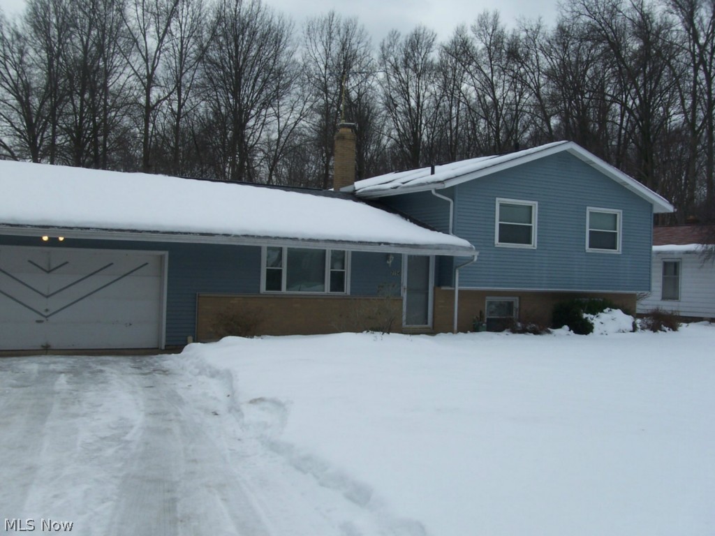 An exceptional 4 bedroom, 2 full bath 4 level split in Stow.  The updated gourmet kitchen has quartz counter tops, top of the line cabinets, and comes with all of the appliances.   About half of the back yard is fenced of this .813 acre lot.  This home has many updates and is move in ready. The large family room walks out, and has a beautiful fireplace.  There is a large living room, eating area, complete lower level for storage, 2 car garage, hard wood floors, and much more.