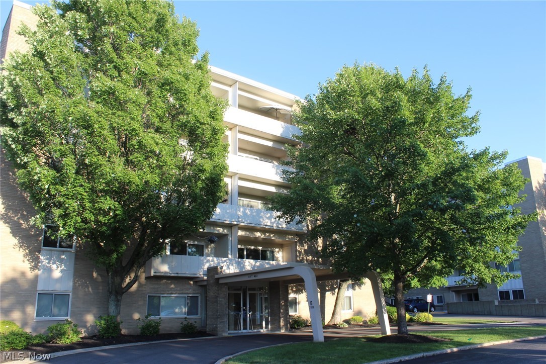 Lovely affordable gracious living in this Rocky River, Cliff Towers, two bedroom and two full bath condo! The spacious living room boasts built-in bookcases and a wall of sliders to your very own extra large covered balcony with a "treehouse" feel and wooded views. The living room opens to a comfortable dining room. The kitchen offers a dishwasher, stove and refrigerator that remain for your convenience. The primary suite has its own full bathroom, and a walk in closet. There are beautiful shutters in both bedrooms.  There is a second full bath too. This condo comes with a storage unit, and a garage spot may be available for $35 per month. Your heat and water are included in your monthly fee so you only pay an electric bill! There is a common patio behind the building. This great location is close to shopping, restaurants, metro parks, freeways, Lake Erie and more!
