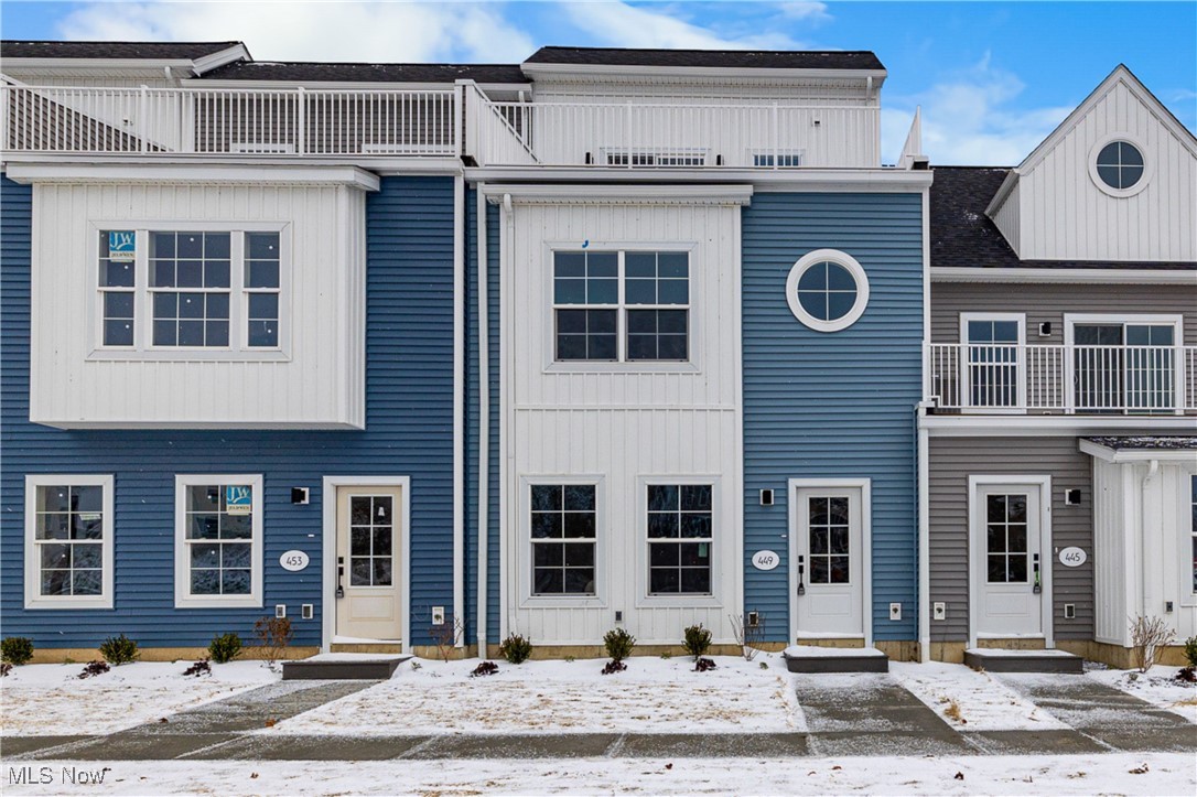 Welcome to Harborwalk. Lorain's Premier Waterfront Community! This brand-new, never-lived-in townhome offers 3 bedrooms, 2 full bathrooms, and 2 half bathrooms. The bright, open-concept main level features durable vinyl flooring throughout and a modern kitchen with quartz countertops, microwave, and dishwasher, all flowing seamlessly into the spacious living and dining areas filled with natural light. Upstairs, the primary suite includes a generous ensuite with a walk-in shower. Two additional bedrooms and a full three-piece bath complete the second level. Continue to the third floor to find a bonus living area with a wet bar, an ideal spot for entertaining or unwinding. Step out onto your private third-floor deck overlooking the river, offering front-row views of summer concerts and year-round events at Black River Landing. All of this is just steps from the Black River, Spitzer and Alliance Marinas, Lake Erie's scenic mile-long pier, and the vibrant Broadway District with restaurants, coffee shops, and the popular Lorain Brewing Company. The community includes a pool and fitness center.  The recently remodeled party center can also be rented for a fee. Waterfront living at its finest! Don't miss this incredible opportunity!