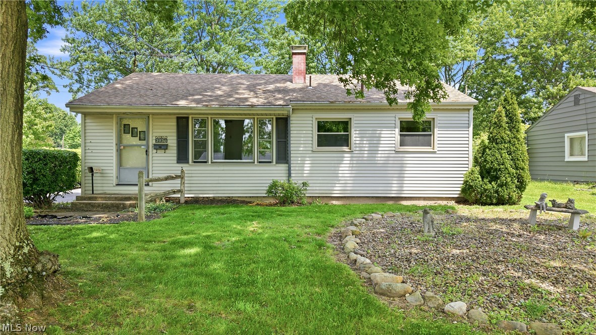 Welcome home to this lovingly maintained, one-owner residence in a fantastic Austintown location! Filled with years of cherished memories, this 3-bedroom, 1-bath home is ready for its next chapter and the opportunity for new owners to create memories of their own. Step through the front door into a comfortable living room featuring carpet with beautiful hardwood flooring preserved underneath. The eat-in kitchen offers plenty of functionality with solid wood cabinetry, laminate countertops, a convenient desk area, and space for everyday dining. Just off the kitchen is a versatile room currently used as a dining room but complete with a closet, making it an ideal third bedroom, home office, or flex space. Two additional bedrooms are located toward the rear of the home, both offering great closet space, carpeted floors, and hardwood flooring underneath. The full bathroom features a tub, tile walls, and vanity. The waterproofed basement provides exceptional additional space with multiple rooms including a laundry area, workshop, storage rooms, and a cozy sitting area, offering endless possibilities for hobbies, organization, or future finishing touches. Additional highlights include vinyl siding, a dimensional shingled roof, forced-air furnace and central air conditioning, a 100-amp electrical panel, and a detached 1.5-car garage. The manageable backyard offers just the right amount of outdoor space for relaxation and enjoyment. Located in the Austintown Local School District and close to shopping, dining, parks, and major roadways, this well-cared-for home is full of potential and waiting for its next owner to make it their own.