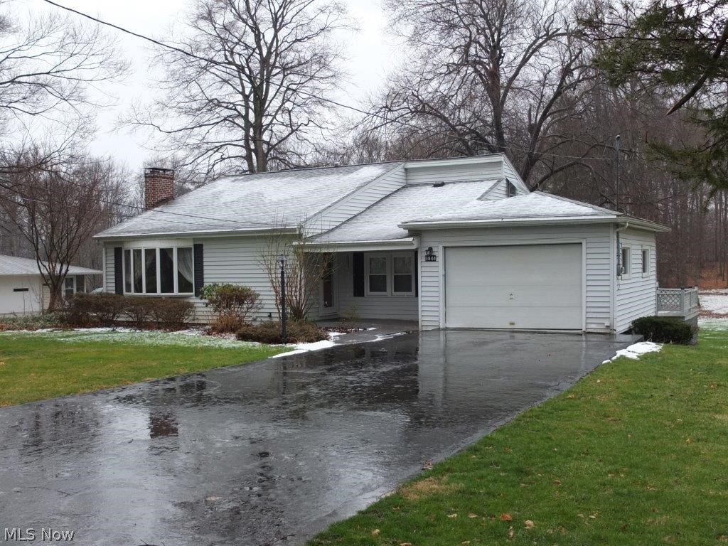 Unique 3-4 bedroom, 3 full bath home with walkout lower level! Vaulted ceiling, 2 story great room with fireplace and bay window. Sunken family room is open to the kitchen and dining room. Fully applianced kitchen with breakfast bar, electric oven, range, dishwasher, refrigerator and over the range microwave. 1st floor master suite has private full bath with jetted tub, corner shower, pedestal sink and huge walk in closet. Additional bedroom and 2nd full bath on the main level. Loft with hardwood floor overlooks the great room. 2nd level bedroom with attached office or play room too. Walkout lower level offers full bath, possible 4th bedrooms and recreation room. Enclosed porch off the dining room leads to the tiered deck that overlooks the large backyard and 1.5 acre lot. Oversized 1 car garage. Schedule a private showing to see all this property has to offer!