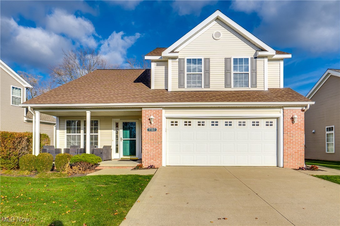 Welcome to Woodland Pointe! This beautifully well cared for cluster home features newer LVP flooring throughout, updated fixtures, throughout the main level. The kitchen offers white updated cabinets with newer hardware, stainless appliances, tile flooring, a pantry, and a spacious eat-in area. The great room and dining area include vaulted ceilings, a gas fireplace, and sliding doors to a newer patio overlooking a private wooded setting.

Convenient first-floor bedroom and full bath, plus first-floor laundry with extra storage. Upstairs offers two additional bedrooms and another full bath. The second-floor master offers his and hers walk in closets.

Major updates include new furnace (2022), new A/C (2022), and hot water tank (2017). New garage door motor and exterior keypad entry. Neighborhood includes walking trails, park, and playground. Prime Tri-City location near Hudson, Twinsburg, shopping, and highways. Move-in ready!