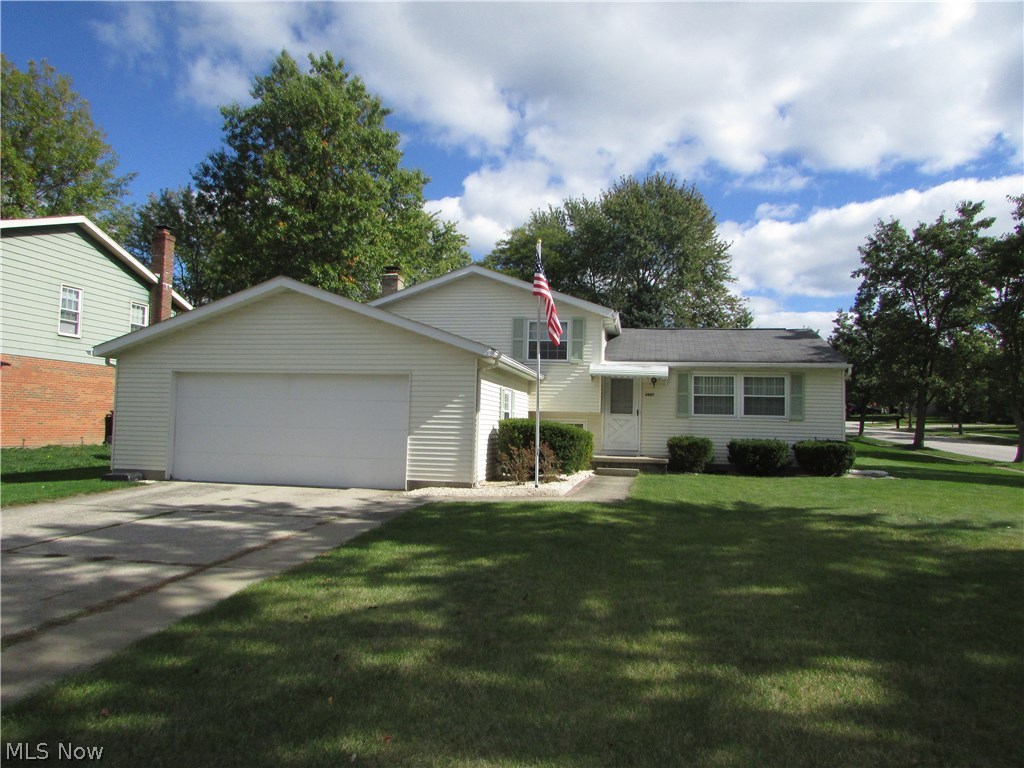 $10,000 PRICE REDUCTION!  An exceptional Sherwood Acres split level with 4 bedrooms, and 2 full baths.  Sherwood Acres Subdivision offers an excellent kid friendly park open to all.  An updated kitchen features newer granite countertops, newer cabinets, and stainless steel appliances.  A large family room has a fireplace.  The cozy living room opens to the dining room and kitchen.  Each bedroom is spacious.  The lowest level is partially finished, with high efficiency furnace with c/a.  There is an attached 2 car garage, ample storage, and so much more to offer.