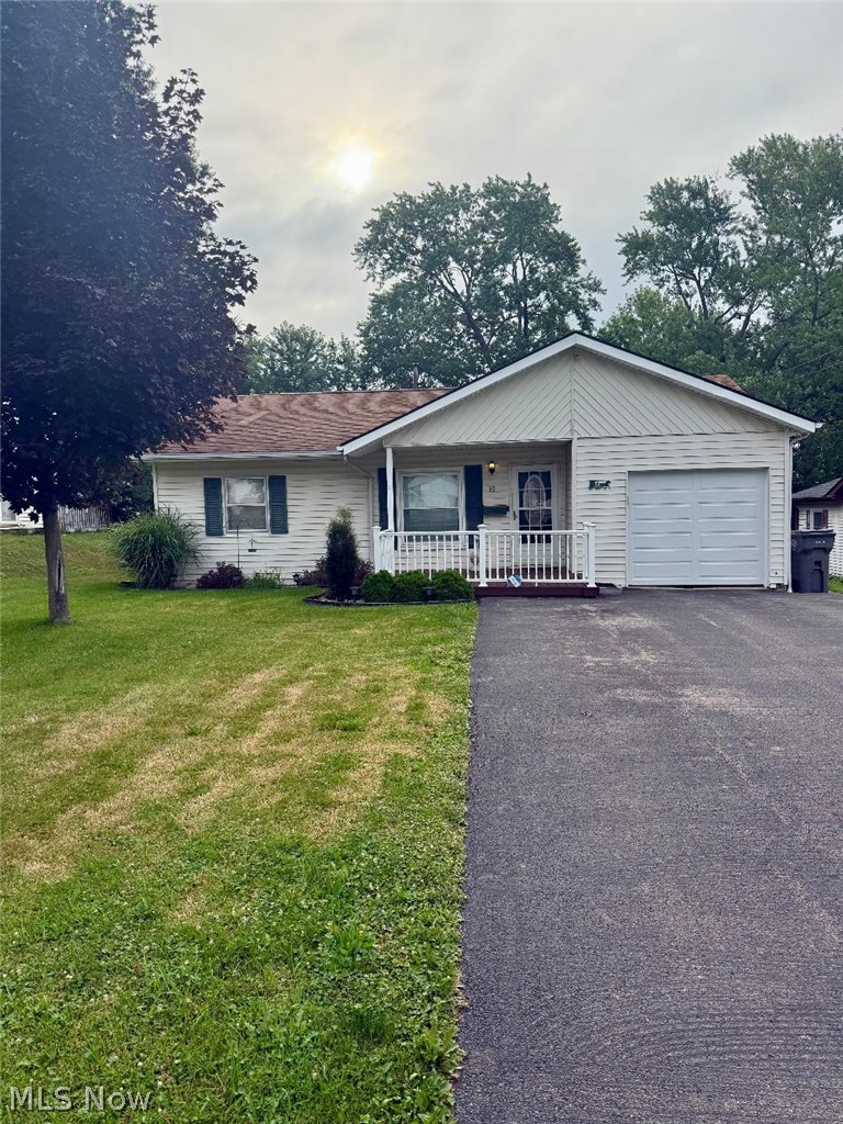 Move in ready 2 bedroom 1 bath with Kitchen Family room and Living room Laundry, covered front and back porch Deck w retractable  Awning, 2 sheds, Fire pit, and fenced in back yard