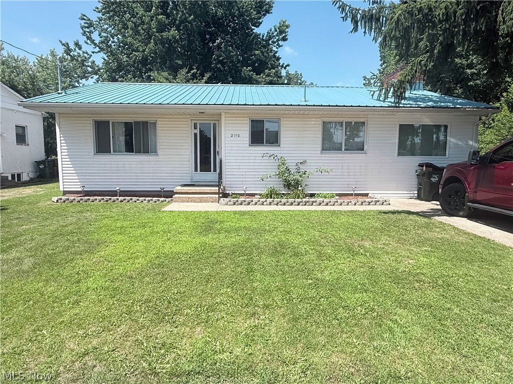 Ranch style home located on Rockland Ave, Belpre, Ohio offering 1,284 sf,. living space on main level and a clean open and basement (984 sf.).!
 The property consists of living room, eat-in kitchen and large family room (30 x 10) with wood burning fireplace, and built-in shelving units on both sides of fireplace. There is also a new large window in the family room and has laminate flooring.The home offers 3 bedrooms and upgrades in the bath.. The one bedroom is currently plumbed for a washer and dryer hook-up but can be moved back to basement to utilize the bedroom. The basement is clean and recently painted and has many options for finishing. The home has original wood floors and the kitchen is offered with refrigerator and range There is a n enclosed back porch with windows looking out to the spacious back yard which has mature trees, flowers and shrubs. The fence is freshly painted black. This property is close to many amenities! Call and come see this well kept home today!