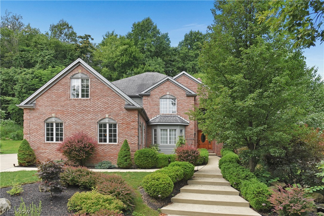 Spectacular Custom Built 2 side brick Estate on a 1 acre lot W/ a priv wooded & peaceful setting,  breathtaking views from every window, Resort setting! Open floor plan, extensive qualities & amenities! 1 owner a true pride of ownership!  2 story foyer double staircases  wood  floors. Gorgeous 2 story great room wall of cust. wind & stone fpl ,  crown mold. beautiful office/den 1/2 wall of wood paneling, door to a private  deck!  Elegant formal dining room ,  stunning  Gourmet kit. w/ cust. cab. , granite countertops, large island walk in pantry, desk are double oven all appliance stay newer flooring. Lg 1st  floor laundry R./ mud room  built-in cab 1/2 wall  bee board paneling, gorgeous 4 season sun room with cathedral ceilings and sliders to the cust  stone patio! 1st floor In-Law/Guest suite w/ full Bath 2flr  spectacular lx master suite Cathedral ceiling  sitting room, 2 walk-in closets build-ins glamour bath w/ double vanities, shower & jet tub,  loft area, 2flr den can be 5 bedr.