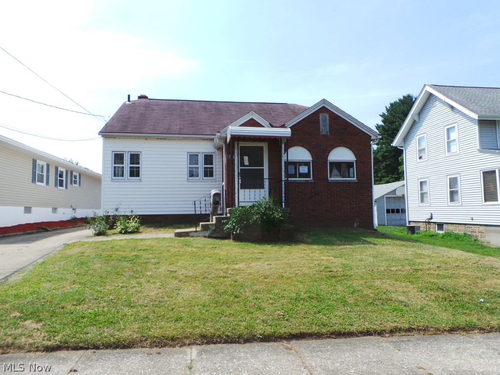 Cute frame and brick bungalow home featuring and updated kitchen and good floor plan of 3/4 bedrooms.  There is a nice two car garage for excellent storage.  Property is sold AS IS.  Equal Housing Opportunity.  FHA uninsurable.