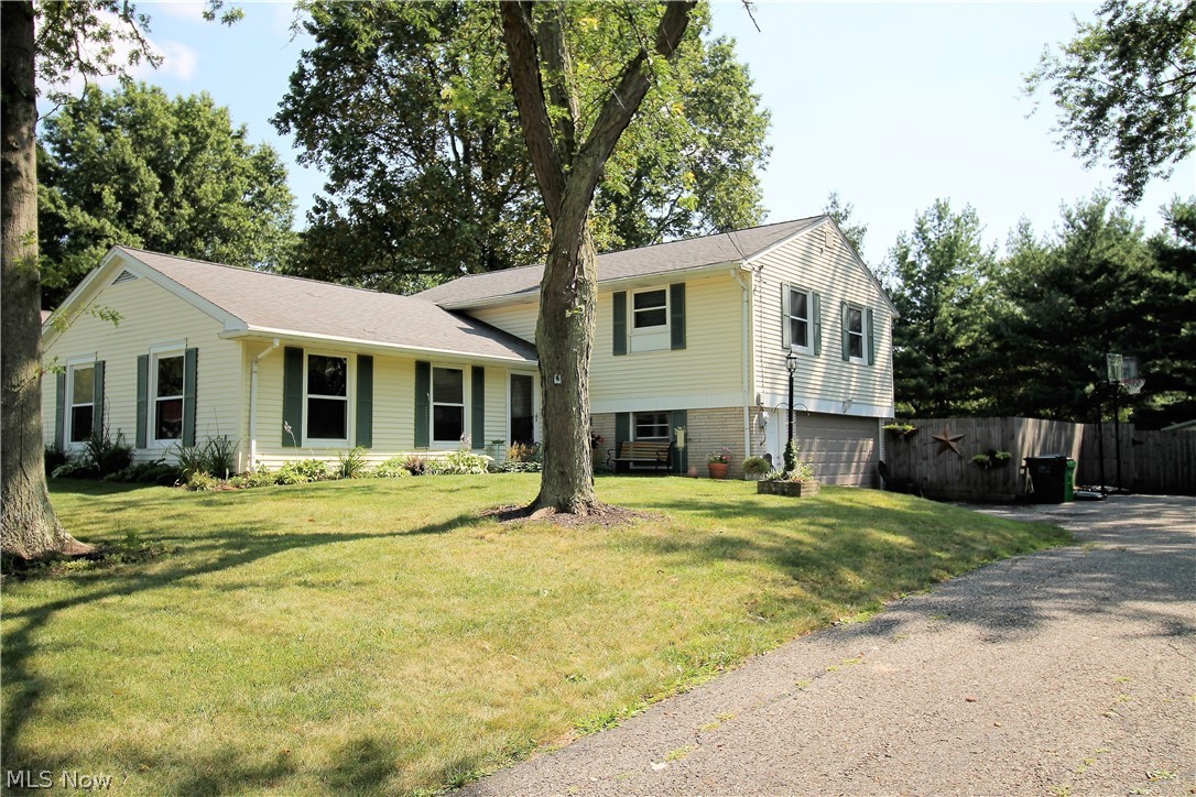 Precious memories begin right here in this stunning updated four bedroom, two and half bath, split level home that radiates with pride and love. Come inside to the open front entry which has new light fixtures and tile flooring (2017) and leads to the living room, kitchen, lower level or upstairs. The living room boasts three spectacular windows, which offer natural sunlight to shine through. The first floor flows seamlessly from the living room to the gorgeous dining room to the modern kitchen.  The kitchen offers abundant cabinets, has recently been painted in 2019, stainless steel appliances, including a wall oven, and there is room enough for a table to enjoy your morning coffee. The upstairs offers four large bedrooms and updated bathrooms. The large master bedroom has double closets. The lower level has a finished family room with sliding door leading to the large fenced in backyard, concrete patio for entertaining and a storage shed, for all the finest outdoor living! There is a