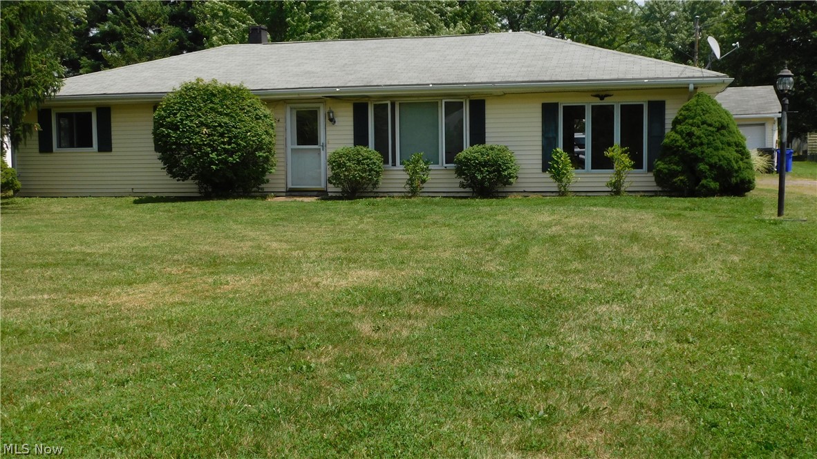 If you are looking for a starter home, or a fixer upper this, 3 Bedroom, 1 bath home is for you and centrally located in Streetsboro. The home does need some TLC including flooring, the A/C, and dishwasher, but it is livable while doing so. There is also a Family Room, Livingroom with a gas fireplace, and a large eat in Kitchen with a 6x4 walk in pantry. There is also a 12x9 utility room that contains the washer and dryer with still plenty room for more including a second bathroom if you want. The well pump was replaced about a year ago, the electric panel was updated about a year and a half ago to 200 amp, and the Hot water tank was replaced about a year ago. The home also has a paved driveway that leads to a 25x25 car garage and sits on a half-acre lot with a shed and plenty of room for a garden, or family functions, the play set in the back yard stays with the home and it can all be enjoyed from your 22x9 covered porch that has a small storage area. The owner is offering a 1-year Ho