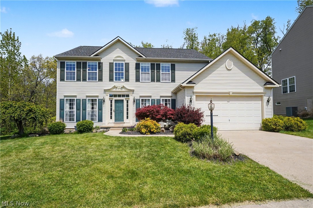 Welcome to this gorgeous 4 bedroom, 3.5 bath home nestled on a private cul-de-sak in the highly desirable Hillside Estates neighborhood and in the REVERE SCHOOL DISTRICT.  Situated on almost half an acre, this home offers exceptional privacy, space and modern upgrades. Designed for both everyday living and entertaining, this open concept features a fully updated kitchen that flows effortlessly into the dining and living spaces. The spacious sunroom and 3 season patio room both fill the home with natural light year round. To finish off the main floor, there is a cozy office with french doors, laundry and a half bath.  Upstairs, you are greeted with a very spacious primary bedroom featuring a primary bath and closet.  There are three more ample sized bedrooms and a full bath to complete this floor.  The fully finished walk out lower level provides additional living space, a bar, full bath and tons of extra space for your imagination. The backyard includes a large deck and a very private serene setting backed up to woods. Super close to some many amenities.  ROOF 2024, LVP FLOORING 2023, KITCHEN REMODEL 2023, HWT 2022, DISHWASHER 2023.