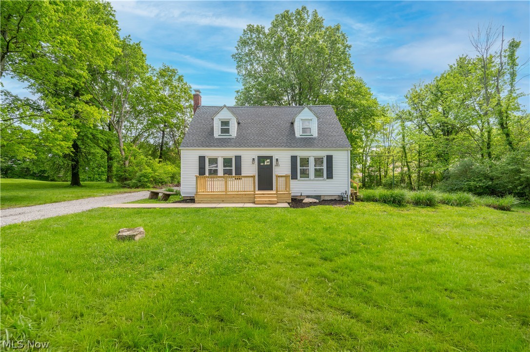 Welcome to the Cape Cod glow-up you were hoping existed. This 3 bedroom, 1.5 bath home in Poland Schools has been freshly updated with the kind of clean, bright finishes that make moving in feel a whole lot less like a project and a whole lot more like a win. Step inside to a comfortable main level with fresh paint, new flooring, updated lighting, and an easy flow between the living area and kitchen. The kitchen brings the good stuff with white cabinetry, new appliances, modern hardware, recessed lighting, and plenty of counter space for coffee, takeout, or the occasional ambitious recipe you saw online and immediately underestimated. The first floor also offers a bedroom and convenient half bath, giving the layout real flexibility. Use it as a main-floor bedroom, home office, guest room, playroom, or the room where you pretend you are going to fold laundry right away.  Upstairs, two additional bedrooms and a beautifully updated full bath keep the fresh feel going. The full bath features subway tile, black fixtures, a modern vanity, and a crisp, polished style that feels current without trying too hard. The basement adds even more usable space with clean a clean look, laundry area, mechanical space, and plenty of room for storage, hobbies, workout equipment, or the seasonal decorations you swear you are going to organize this year. Outside, the setting gives you room to breathe with mature trees, usable yard space, a detached 2 car garage, and a backyard that feels private without being isolated. There is space to play, garden, relax, entertain, or finally become the person who owns patio chairs and actually sits in them. With fresh updates, a smart layout, great storage space, a detached garage, and a Poland Schools location, this home is ready for its next chapter. And unlike a lot of houses, this one does not need a motivational speech before showings.
