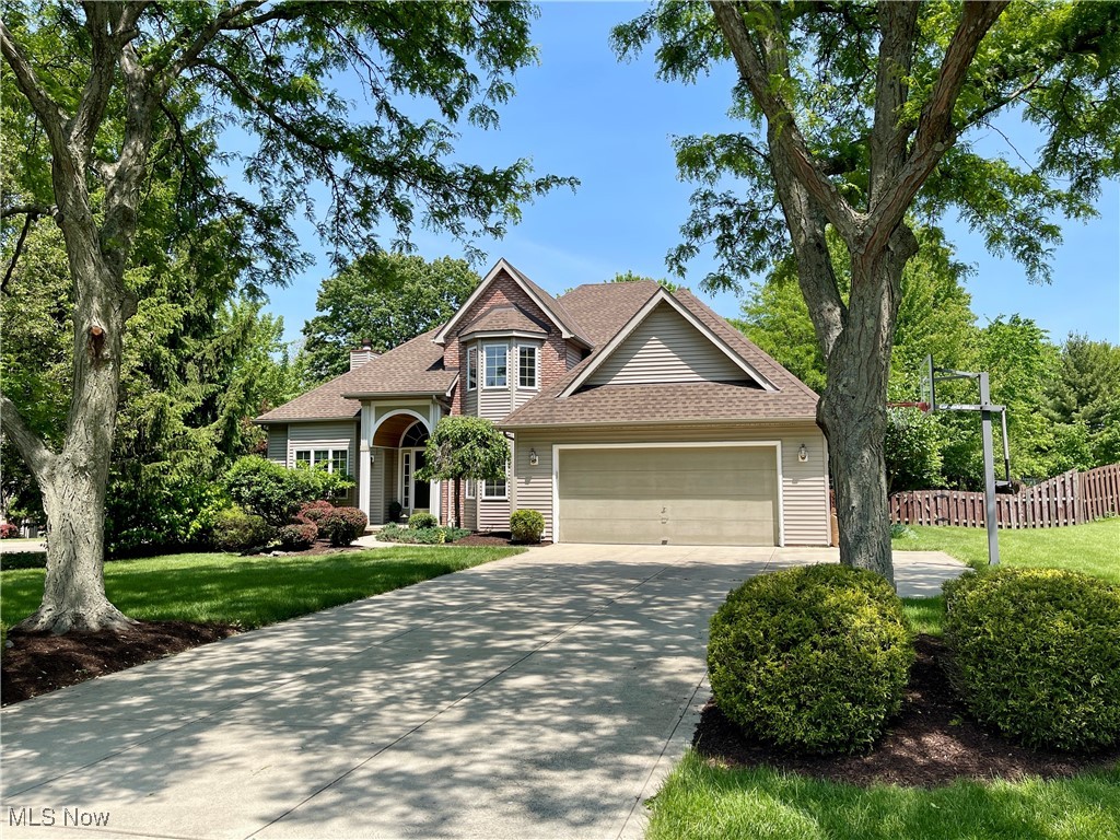 Don’t miss this beautifully maintained 4 bedroom, 2.5 bath Colonial located in the highly sought after Royal Valley neighborhood, within the award-winning North Royalton School District! You'll feel right at home the moment you step into the spacious two-story foyer. Engineered hardwood flows seamlessly through the entryway, dining room, hallways, and kitchen. The formal dining room offers a touch of elegance with a tray ceiling and bow window. The vaulted ceiling family room is warm and inviting, featuring a custom stone gas fireplace, built-ins, and a wall of windows overlooking the scenic backyard. Central to this home is the tastefully remodeled kitchen with spacious sitting area, highlighted by elegant quartz countertops! Enjoy the comfort of a first-floor primary suite, featuring a tray ceiling for added sophistication and a walk-in closet designed with convenience in mind. Retreat to your serene ensuite, complete with a vaulted ceiling, skylight, double vanity, custom Amish cabinetry, and a beautifully tiled shower. Convenience abounds with first-floor laundry with direct access to the two-car garage. The kitchen opens to a stone paver patio with a built-in firepit and pergola, creating a perfect spot for relaxation and gatherings. Upstairs includes three generously sized bedrooms, a full bath, and ample closets. The partially finished basement adds valuable extra living space ideal for a home office, an exercise room, or hosting memorable game nights with family and friends. Professional landscaping adds to the home’s crisp curb appeal. Notable updates include a custom staircase in the foyer, complemented by new interior doors, trim, and baseboards on both the first and second floors. Located close to North Royalton Library, YMCA, local parks, shopping, and restaurants. This move-in-ready home offers the perfect blend of comfort, style, and prime location. Schedule your showing today and fall in love!
