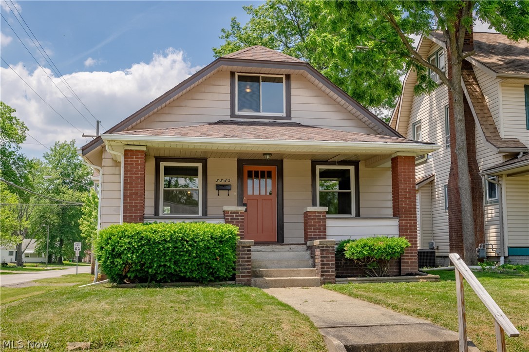 Welcome to this beautifully updated bungalow that blends character and modern updates throughout. From the moment you arrive, the inviting covered front porch creates a warm first impression. Step inside to a spacious living room featuring brand-new flooring that flows seamlessly into the dining room with updated flooring and lighting, creating a comfortable and functional gathering space. The kitchen has been thoughtfully updated and offers abundant counter space, new appliances, new countertops, and updated lighting. The former breakfast nook has been incorporated into the kitchen layout, providing even more workspace and an ideal location for the refrigerator, maximizing both functionality and storage. The main level also features a fully remodeled bathroom with tasteful finishes and two generously sized bedrooms with new flooring. Upstairs, a unique layout offers a versatile space that could serve as a home office, reading nook, or hobby area before entering the spacious primary bedroom. Original hardwood flooring has been preserved and refinished, adding character to the upper level. The basement is currently unfinished and offers excellent storage or future expansion potential. Completing the property is a large detached two-car garage providing ample space for vehicles, storage, or workshop needs. This move-in ready home offers a combination of charm, thoughtful updates, and functional living space. Schedule your showing today to see all it has to offer.