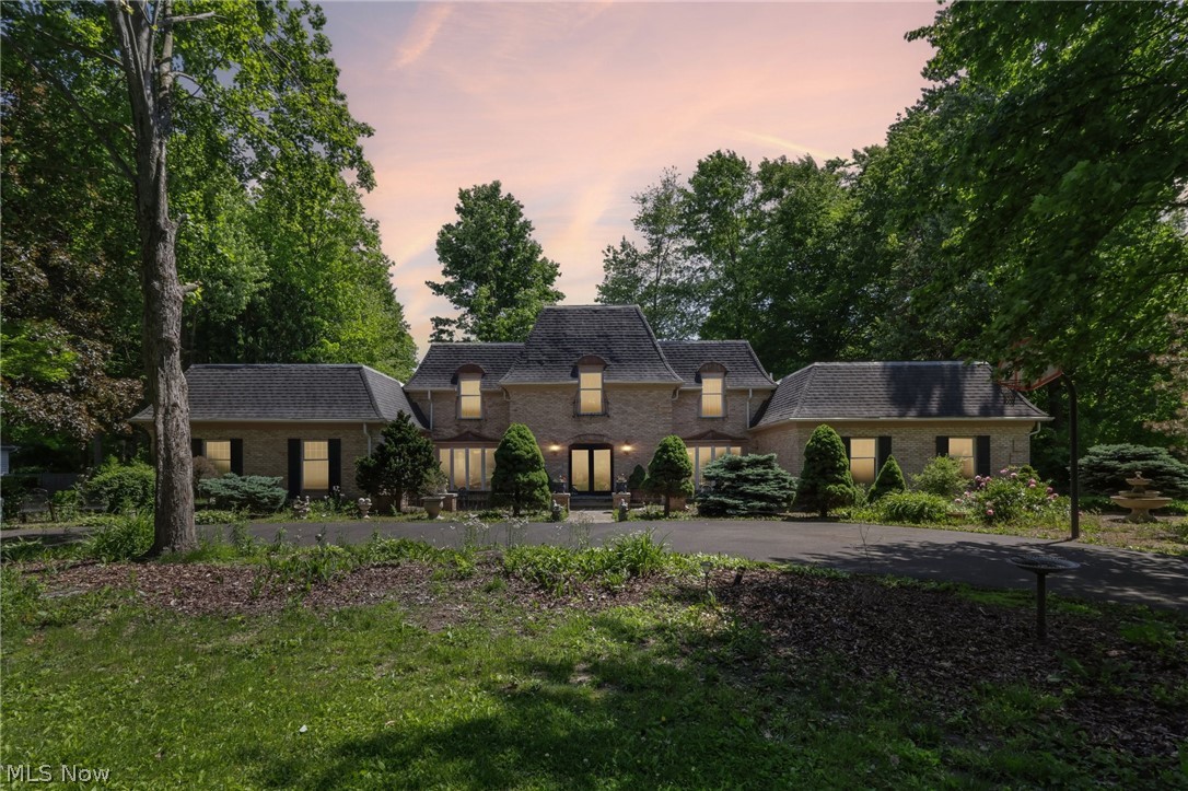 Welcome home to this spacious and inviting 2-story brick residence offering over 4,800 square feet of comfortable living space designed for making memories. With 4 bedrooms, 3 full baths, and 2 half baths, this home provides plenty of room for family, guests, and everyday living.  From the moment you walk in, you’ll appreciate the generous room sizes, warm gathering spaces, and classic charm throughout. The large family room and formal dining room create the perfect setting for family dinners, holiday celebrations, and entertaining friends. Two fireplaces add warmth and character, making cozy evenings at home even more special.  The thoughtfully designed layout offers over 3,000 square feet on the main floor, giving everyone room to spread out while still feeling connected. Upstairs, spacious bedrooms provide peaceful retreats at the end of the day.  Situated on a beautiful dual parcel totaling almost 5 acres, this property offers space to roam, play, garden, or simply enjoy the beauty and privacy of country-style living while still enjoying the convenience of being close to shopping, schools, freeway access, and medical facilities.  Built with timeless brick construction, this home also features central air, a spacious basement, and a 2-car garage. Important updates—including a newer furnace and A/C, a new tankless water heater, and a rolled roof that has been relaid over the back portion of the home—provide added peace of mind, so major maintenance concerns won’t be top of mind for years to come.  With its solid construction, generous living areas, and welcoming feel, this home offers the perfect opportunity to create your own vision and enjoy years of comfortable living. Whether you're hosting family gatherings, celebrating milestones, or simply enjoying everyday moments, this home is ready to be the backdrop for your next chapter.  This is truly a must-see property—and hopefully, your next place to call home.