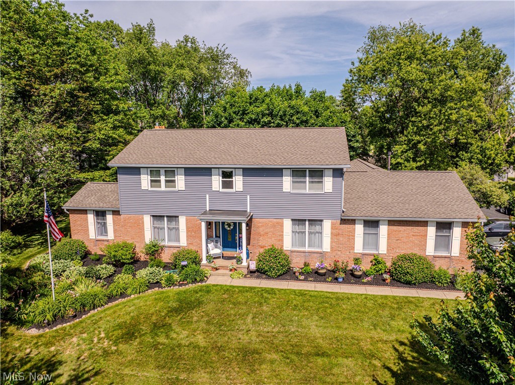 Prepare to be enchanted by this breathtaking Colonial estate, a rare jewel nestled on a sprawling 1+ acre lot right in the heart of Louisville. While the home is magnificent, its true heart is an unbelievable oasis backyard—a private, living canvas designed for grand entertaining and quiet dreaming. A Backyard Beyond Imagination! Step into a literal wonderland. This isn’t just a yard; it is a sun-dappled sanctuary framed by a vibrant tapestry of perennials, flowers, and mature trees. Listen to the melodies of an elegant water feature cascading near your private patio and cozy fire pit. Host unforgettable gatherings on the patio and deck, share stories while you melt the day away in the hot tub.  The inside of the home offers elegant and versatile living with fresh paint and new flooring bringing together a floor plan filled with grace and comfort.  The Main Level: Host lavish dinners in the formal living and dining rooms, supported by an enormous butler’s pantry. Gather in the open-concept kitchen, dinette, and family room with a cozy gas fireplace.  Rare Multi-Gen Wing: A magnificent first-floor find features a handicap-accessible suite with 2 bedrooms and a full bath, alongside first-floor laundry. The Second Floor Hideaway: Ascend to a refreshed haven featuring three huge guest bedrooms, a full bath, and a private primary suite boasting two large closets and a newly remodeled 5-foot shower. Lower Level: A fabulous recreation room offers extra play space alongside massive storage. This is Turn-Key Perfection! Enjoy peace of mind with a staggering list of premium updates: 2026: New refrigerator, 2nd-floor deluxe vinyl & carpet, whole-house ceiling paint, porch roof, sump pump, and master shower. 2025: Brand new HVAC & garage door opener. 2024: 1st-floor deluxe vinyl flooring. 2023/2022: Finished lower level, dishwasher, custom patio & water feature. 2021: New main roof & siding. Your happily ever after awaits. Call today for a private tour!