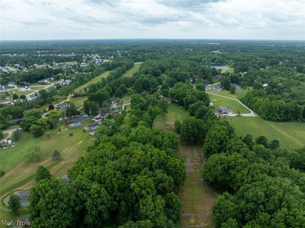 Rare opportunity to own 4 beautiful acres in a desirable North Ridgeville location! This expansive parcel offers endless potential for those looking to build their dream home, establish a private retreat, or invest in valuable land with room to grow. Surrounded by nature and offering plenty of open space, the property provides a unique setting with the flexibility to bring your vision to life. Value is in the land. Existing house and barn are being sold as-is and are considered to have little to no contributory value. Due to the condition of the structures, use extreme caution when entering. All parties entering the home do so at their own risk. Please review and sign the Hold Harmless Agreement located in the supplements prior to entering the house. Buyer to perform their own due diligence regarding zoning, building, and future use possibilities.