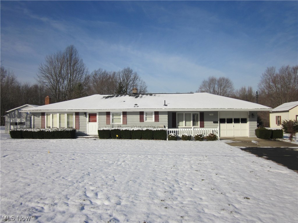 Nicely maintained ranch style home features beautiful hardwood floors, updated kitchen with eat-in area, heated sun room, partially finished basement with wood burner and summer kitchen area.  One car attached garage plus 24 x 32 out building and a 12 x 16 detached garage - ALL ON 2.5 ACRES.