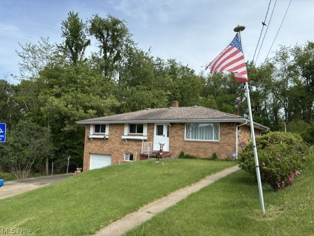 Weirton Heights — Welcome to this well-maintained, move-in ready Brick Ranch featuring 3 bedrooms with hardwood floors, 1.5 baths, and a beautiful All Seasons Room to enjoy year-round. Step inside to a bright living room filled with abundant natural light. The updated, fully equipped kitchen offers ample cabinet space and flows seamlessly into the dining area, creating a warm and functional layout.  The lower level provides additional living and entertainment space with a spacious rec room complete with a bar, laundry area with cedar closet, abundant storage, and a convenient half bath. A one-car garage with workbench, along with a cement parking pad for an additional vehicle or boat, adds to the home’s functionality.  Additional updates include replacement windows, fresh interior paint, and a gas furnace approximately 6 years old. Situated on a dead-end street, this property offers the perfect balance of comfort, privacy, and convenience. Enjoy the level fenced backyard—ideal for gardening, pets, or entertaining—plus a storage shed for added space.  Conveniently located near shopping, the post office, schools, hospital, and Route 22 for easy access to Pittsburgh and Robinson. If you’re looking for all of the above, schedule your private showing today!