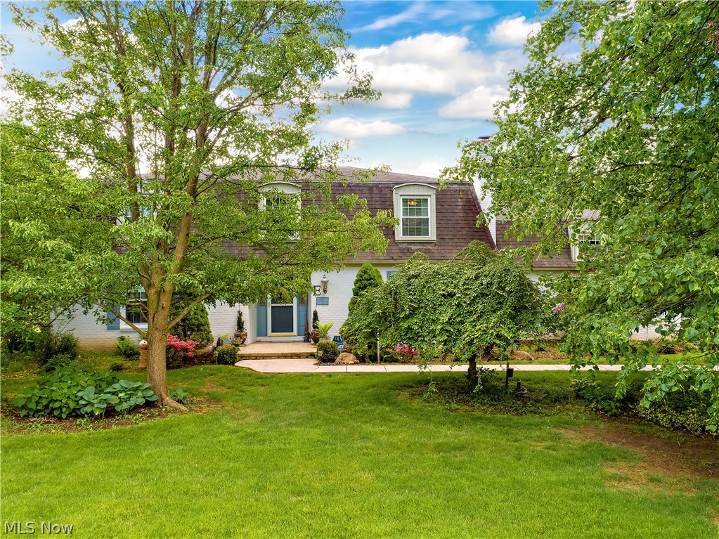 This two-story colonial is so charming! The large lot is very private. There is a huge covered patio off the kitchen, perfect for entertaining. The kitchen has painted cabinets with a center island with granite. The family room is super cozy with a fireplace. Large living room and dining room. There are 4 bedrooms upstairs and all baths have been remodeled. Master-suite is very nice and large... beautiful home!