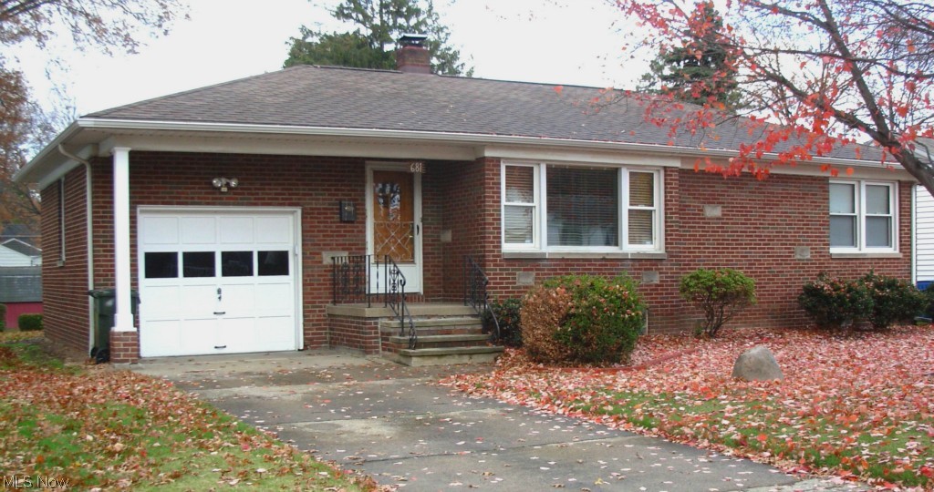 Super clean 2 bedroom brick ranch with 1 car attached garage.  New carpeting in kitchen, eating area and hallway. Polished hardwood floors in Living room and bedrooms.  Woodwork trim in great condition. Freshly painted walls throughout.  Newer stove, dishwasher, furnace.  Ceramic wall tile, clothes chute and linen closet in bathroom.  Small foyer and coat closet at front door.  Working shower stall in basement. Plumbing in basement for commode. Newer blown in insulation in attic space. Good sized closets. Glass block windows, cedar closet, storage closets, fruit cellar and extra room in basement. Rear patio, covered front and back porch, and small storage shed on good sized backyard. This home is close to grocery stores, Tuscora Park, pharmacies, restaurants, hospital,and Dr. offices. The street is only two blocks long.  This home is move in condition.