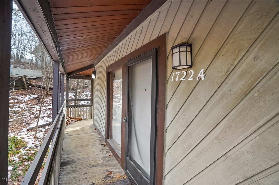 Nestled in a serene, tree-lined setting, this inviting two-bedroom condo offers a full bath for each bedroom, providing comfort and privacy for residents and guests alike. The living area features a charming wood-burning stone fireplace, perfectly complemented by large windows that fill the space with abundant natural light and scenic views of the surrounding greenery. Enjoy the convenience of in-unit laundry, complete with a washer and dryer, as well as a one-car garage equipped with an automatic opener. Ideally located just minutes from popular restaurants and shopping, this condo also places you close to the trails and outdoor recreation of Cuyahoga Valley National Park—perfect for hiking, biking.  Woodridge Schools too. A wonderful blend of peaceful surroundings and everyday convenience. Make this cozy condo yours today.