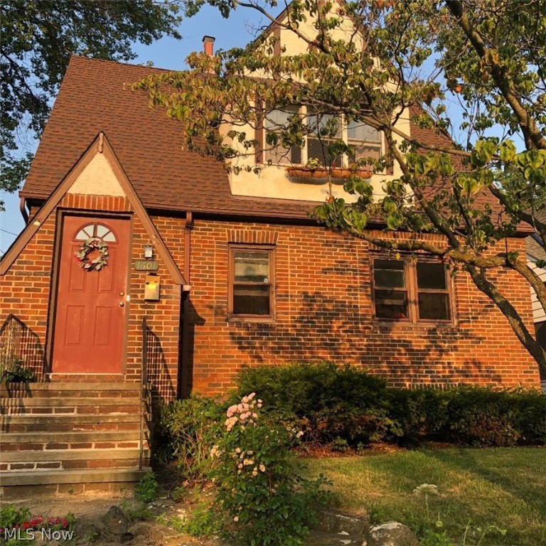 Great Tudor-Style Brick Colonial in Rocky River's "Library District. This home offers Large, Inviting First Floor Social Areas. The Living Room has newer wood flooring and the Kitchen is upgraded with newer kitchen cabinetry, flooring and stainless steel appliances. A Pass-Thru window to sitting room (used to be called a "sewing room") can be amenable to a breakfast room, kids' craft room, homework room or game room. This room overlooks the rear yard that has a Nature environment area with a stone pond just made for your relaxation mood. The kitchen has ample cabinetry and counter space made for the chef in the family and also has skylights in a vaulted ceiling that add charm and daylight warmth for a bright, sunny start of your day. There is a formal Dining Room to accommodate your large family feasts and an extended Living Room area for relaxation, TV and gaming. There are two bathrooms, one on the main floor and one on the second level. A full basement is comfortable enough for an e