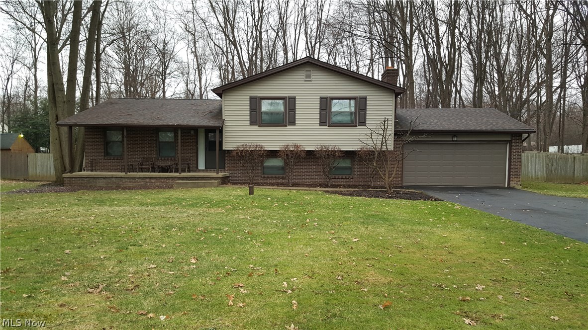 It is Apparent!! These homeowners have done their home-work throughout the years, and have meticulously maintained this wonderful family home. This spacious 4 level split features kitchen w/newer appliances, countertops, flooring, breakfast bar and open to dining room (slider to deck) and living room area. Lower level w/fantastic family room w/woodburning fireplace, 2 1/2 bath and walk-in-laundry room-clean partial basement. 3 sizeable bedrooms, Master w/full bath and 2 double wall closets. Updates include new roof, windows, and siding, interior all freshly painted-desirable neutral decor, newer carpet, and flooring. Large fenced in back yard deck and shed, 2 car garage and the always requested "covered front porch!" This larger home is great for entertaining!No septic, just well. It is spotless, no grime here! A positive----move in ready---!