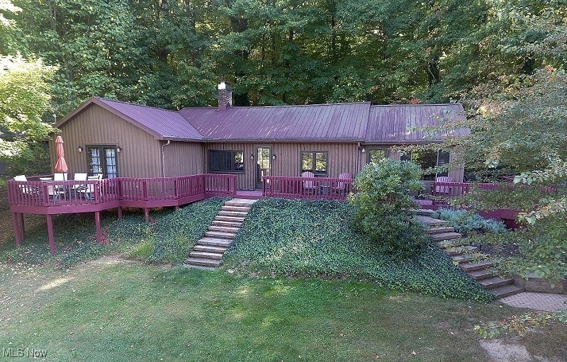 Turn Key, 2 bedroom, 2 bath Atwood Lake home is located in the popular Atwood Glens community on a beautifully landscaped lot with stunning paver retaining walls & patios. This well cared for lake home is being offered fully furnished (excludes sectional in sun room), including bed & bath linens, kitchenware, etc. so the new owners can have immediate enjoyment while saving thousands. Perfect for year round living or as a second home. Freshly painted inside & out. This updated ranch home offers an open format living room with stone gas log fireplace, kitchen with all appliances, eat at bar & solid core countertops & dining area. The loft provides a fun 3rd bedroom area for kids or great storage. A spacious 20x14 - 4 season sun room provides a fabulous area to entertain or just enjoy with the family. The master suite provides a full bath with oversized shower & private access to the deck. A spacious second bedroom provides enough space for multiple beds. Second full bath. A large wrap around deck offers fabulous outside space for enjoying the outdoors, grilling & family fun & features a 18' Sunsetter retractable awning. Of course, a private floating dock is included for your nautical toys to cruise & play on the 1540 acres of picturesque Atwood Lake. The basement provides space for the washer & dryer included, as well as plenty of storage space. A utility garage adds more storage space & is perfect for golf carts, kayaks, etc.. Newer water softener. Worry free metal roof. 2014 Sweetwater 23'8" Pontoon boat with 25 hp Yamaha motor available to purchase separately. 2024 MWCD Lot Lease Rate is $1,752. 1 Year Home Warranty included offering peace of mind to the new owner. Be sure to view the detailed 3D virtual tour. Isn't it time you turn your dream of owning a lake home into reality?