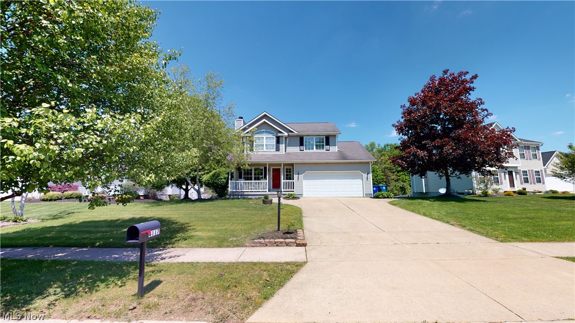 Wonderful 3-bedroom, 2-1/2 bath updated Colonial in Timber Run.  Large, bright living room with gas fireplace with new fieldstone hearth, open to eating area and kitchen with all appliances and island with butcher block top and concrete countertops and farmhouse porcelain sink, that leads to 2nd story deck, overlooking the "Nature Preserve" behind your backyard!!!  Living room and kitchen have floating, distressed/hand scraped laminate flooring, 1st floor laundry/mud room and half bath have ceramic floor.  Upstairs is Master bedroom with cathedral ceiling, walk-in closet and master bath with double sinks and cathedral ceiling.  Two more large bedrooms, one with another cathedral ceiling, and one with a wall of distressed barn wood, and full bath with yet another cathedral ceiling complete the upstairs.  Lower level is unfinished but is a walk-out to patio and has a movie screen on wall from previous theater room, lots of possibilities here!  There's also attached 2-car extra deep garag
