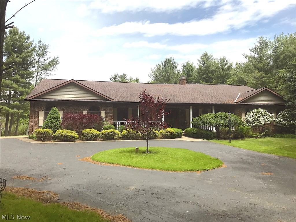 This beautiful sprawling brick ranch, has much to offer.  Open floor plan, large gourmet kitchen with granite counters, hard wood floors, abundance of cabinets with breakfast bar and dinette.  Large family room includes fireplace and built ins.  Walks out to four season room.  Finished walk-out basement with full kitchen/wet bar.  Circular drive way on a quiet cul-de-sac street. Possible in-law suite. A must see!