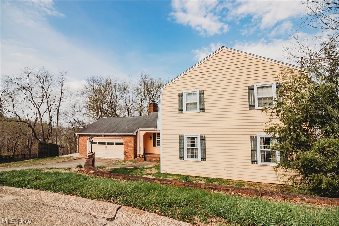Seller is motivated and ready to sell! Offering approximately 2,800 sq. ft. of finished living space above grade, plus an additional 800 sq. ft. in the walkout basement, this spacious home provides room for everyone. The main level features an inviting eat-in kitchen, formal dining room, expansive living room, convenient first-floor laundry, and a half bath. Predominantly hardwood flooring adds warmth, character, and timeless appeal throughout the primary living areas.

Upstairs, the spacious primary suite offers a private bath and walk-in closet, while three additional bedrooms and a full hall bath provide ample space for family, guests, or hobbies.

The walkout basement adds valuable flexible living space, ideal for a recreation room, home office, fitness area, or media room, along with additional unfinished storage space. With its generous floor plan, desirable layout, and motivated seller, this home presents an outstanding opportunity for its next owner.

Schedule your private showing today!