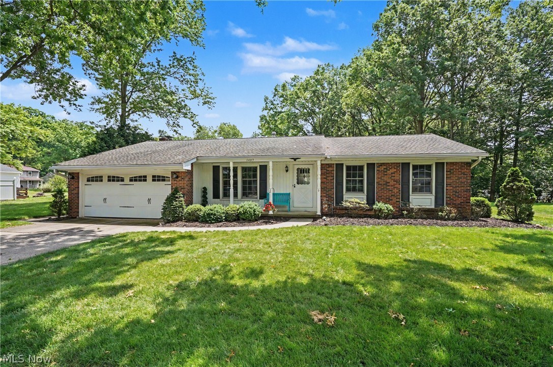 Pristine, meticulously kept, and immaculate are just a few words to describe this well taken care of, rare find, ONE owner Ranch Home in Heather Hills. This one level home is in a convenient location, in a mature neighborhood that has withstood the test of time. This home has 3 bedrooms, 1.5 baths, a sunroom, formal dining room, living room, family room with a brick gas fireplace, eat-in kitchen, full front porch, carriage style garage door, rec room area in the basement, and a stellar yard. Excellent curb appeal! There are solid hardwood floors in every room with the exception of the family room. There is a 2 car attached garage complete with nature stone flooring. The unfinished area of the basement has nature stone flooring, also.
The updated full bath has a convenient walk-in shower with glass doors , and the master bedroom has a half bath, and a large double door closet with built ins. The living room is spacious and leads to the formal dining room and hallway both with refinished hard wood flooring, and the dining room overlooks the gorgeous and large back yard. The family room leads into the fabulous sunroom for relaxing and enjoying 3 seasons of the year! The sunroom has slider doors that open to the backyard.  The slider door from the family room to the sunroom was replaced by Anderson windows in 2024. The HVAC system was replaced in 2018. All appliances stay with the property. The finished part of the basement has a wonderful built in desk area, and makes it a perfect for recreation, office, den, or craft room. Don’t miss this one, it’s a gem!