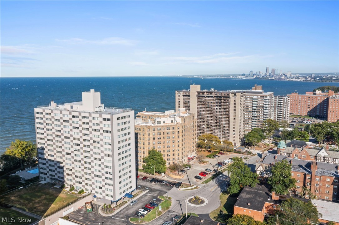 Welcome to Marine Towers East! Move in and enjoy the Resort Lifestyle with this renovated and updated (2021) 2-bedroom, 2-bath, corner unit located on the Lake Erie Waterfront of Lakewood's desired Gold Coast. Removed walls to create a unique open floor plan that provides vinyl plank flooring and large wraparound windows exposing the space to natural light and beautiful views. The kitchen includes stainless steel appliances, quartz counter tops, newer cabinets, and tile backsplash. The primary bedroom consists of newer carpet, a walk-in closet, and en-suite bath. The secondary bedroom offers space for home office or additional living space with two closets. Enjoy what the building has to offer at the upstairs penthouse and roof top deck, perfect for entertaining or relaxing with great panoramic views of the lake and city! The building also includes indoor parking (monthly fee) and free outdoor parking, car wash station, secured entry and package room, bike storage, fully fenced dog area, guest suite for visiting friends or relatives, and an in-ground outdoor pool!
