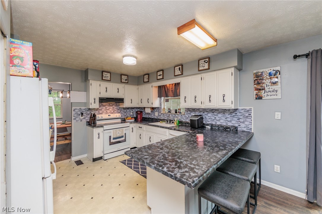 A wonderful, and rare, 4 bedroom ranch in the desirable Sherwood Acres neighborhood of Stow.  This home has a large master suite, and a second full bathroom that was recently remodeled.  With a living room, family room, and a formal dining area, this 1800+ sq ft home is perfect for entertaining.  There is a full basement, attached 2 car garage, a nice yard, patio, and so much more.