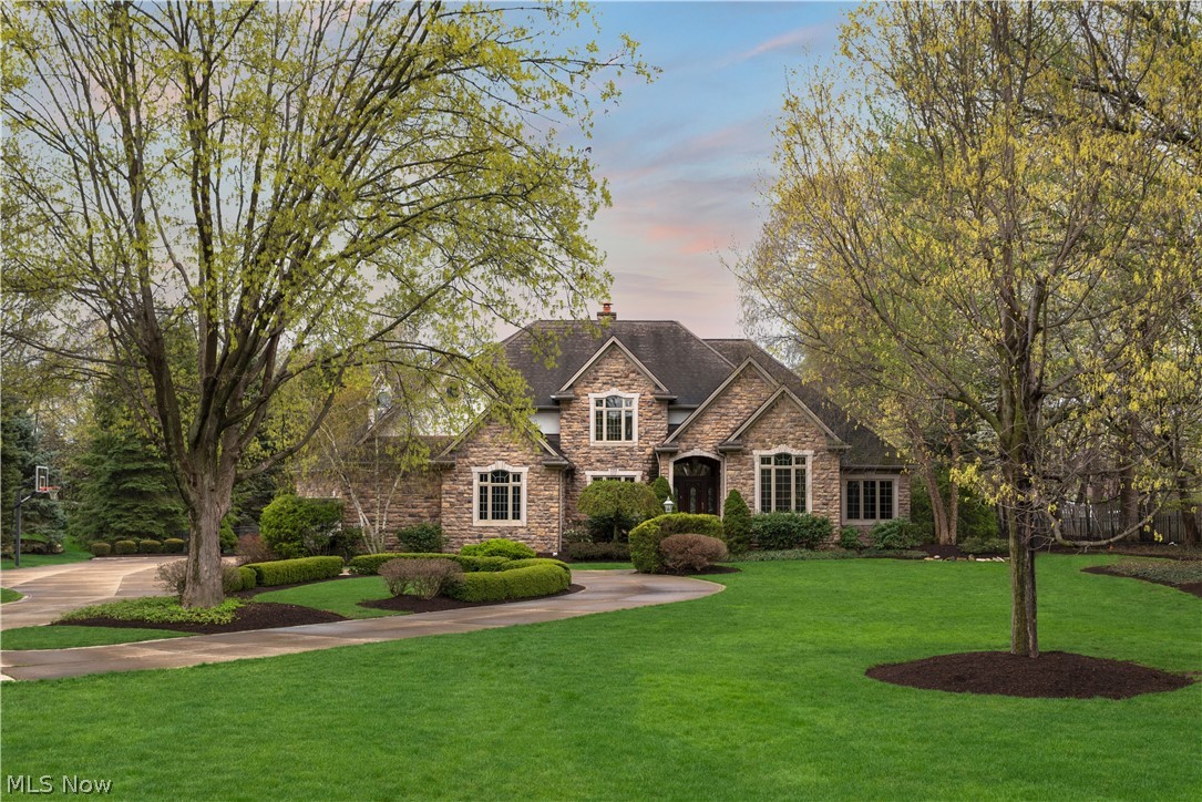 This stunning residence sits on beautiful mature park like grounds with perfectly manicured plush gardens. Paved patio big enough for summer fun leads to the kitchen/family room.  Extensive use of marble and granite, new hardwood in the formal dining room, that includes a butler's pantry. New carpeting in many rooms, including formal living room, bedrooms! The welcoming grand marble foyer invites touring of this impressive home featuring stone and ornate wood finishes throughout as well as overall superior architecture such as an open floor concept and custom tray ceilings.  Newer appliances, breakfast bar, charming dining nook. First floor master suite with glam bath, and a sitting room. You may never leave! Second floor bedrooms with their own baths. 
The finished basement with an additional private entrance features a finished entertainment living space with bathroom, bedroom, and music studio.  Huge garage, finished outbuilding with heat & A/C, a fire pit and many mature trees. Ne