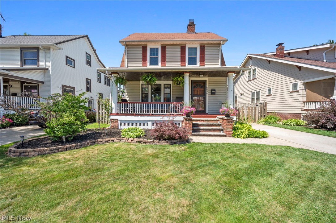 You'll fall in love with this beautiful Lakewood home from the moment you arrive. Attractive landscaping and a classic covered front porch create outstanding curb appeal. Ideally located near parks, restaurants, shopping, and Downtown Cleveland, you'll enjoy all the charm and convenience Lakewood is known for. Step inside to a spacious living room highlighted by a decorative fireplace and large windows that fill the space with natural light. The beautifully renovated kitchen features crisp white shaker cabinets, a striking dark center island with seating, original built-in cabinetry with leaded glass doors, quartz countertops, subway tile backsplash, stainless steel appliances, and stylish pendant lighting. With direct access to the back deck, this space is perfect for everyday living and entertaining. Just off the kitchen, a bright breakfast area features a built-in bench and cabinetry, creating the perfect breakfast nook or mudroom-style drop zone. Upstairs, you'll find three spacious bedrooms and a hallway showcasing gorgeous, original built-in cabinets and drawers. The fully remodeled bathroom features a stunning vanity with matching medicine cabinets, black and gold hardware, and a deep soaking tub. The finished third level offers flexible space for a family room, home office, or hobby area. The partially finished lower level is ideal for a recreation room or game area. A stylish half bath features a sliding barn door, painted brick walls, wood accents, and vintage-inspired finishes. Laundry and ample storage complete this level. Head outside to your private backyard oasis! The fully fenced yard features a large deck, paver patio, and grassy area, perfect for summer gatherings and outdoor enjoyment. A detached two-car garage completes this exceptional property. Offering the perfect combination of historic charm, thoughtful updates, and an unbeatable location, this is one you won't want to miss. Schedule your showing today!