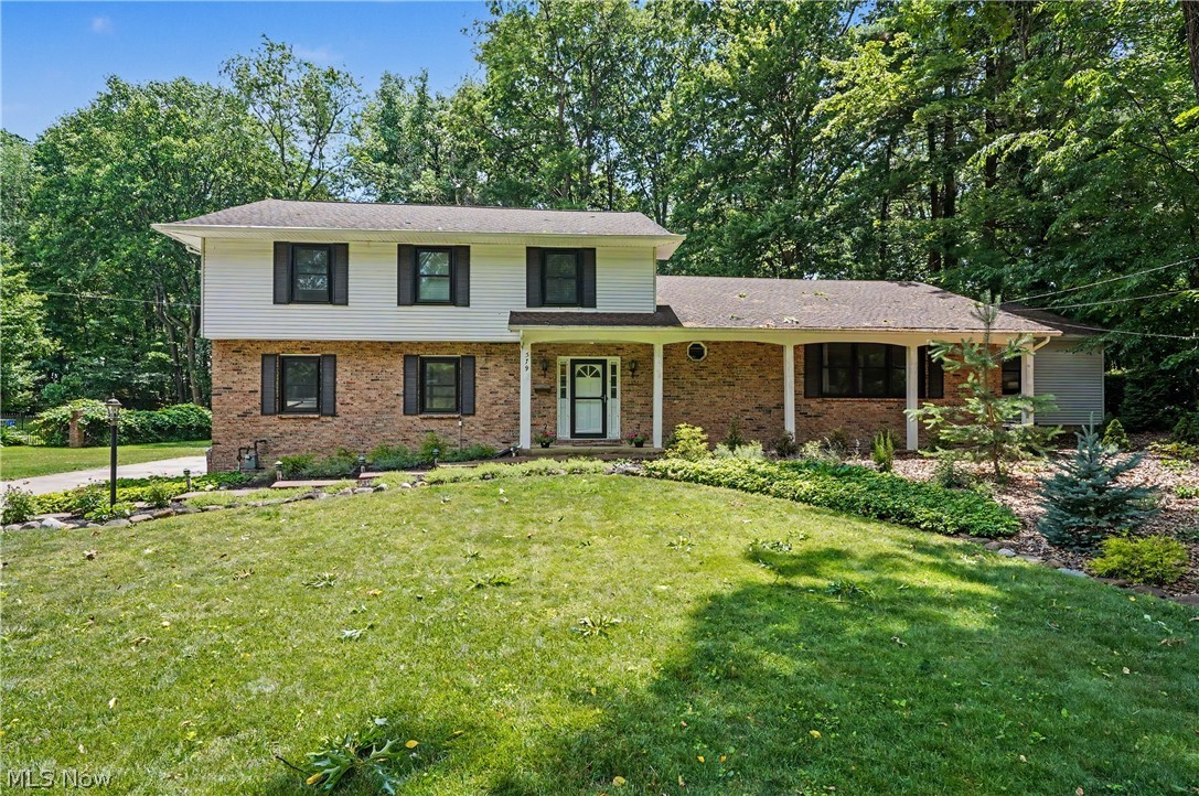 Welcome to your private oasis located in a desirable neighborhood in Akron, on a dead-end street in Nob Hill. This beautifully landscaped, 3,000+ sqft colonial offers the perfect blend of modern updates, architectural charm and multi-generational living with an In-Law Suite. The main home features beautiful wood floors throughout most of the home. The vaulted great room is accented by rustic exposed beams. Step down into a cozy family room with a wood-burning fireplace which is close to the back window to watch the snow while drinking hot coco! Coming off that room will be the first floor laundry, a half bath and entrance into the spacious garage. The coveted In-Law Suite is perfect for multi-generational living. The addition features it's own kitchenette, bedroom, updated bathroom and living room. It also has it's own deck and access to the basement. The private back yard is a peaceful retreat and features a shed for all of your gardening tools. The covered deck features skylights, to ensure many outside enjoyment opportunities. The current sellers made improvements such as newer windows and screens, various doors throughout, new garage doors and openers, newer hot water tanks, and kitchen appliances within the last 3 years, and more. The home has an enormous amount of storage and is much larger than it first appears. The sellers had a pre-listing home inspection for your review. Some items have already been worked on. If you have ever needed a home with non-wasted space, here it is. Much of the heavy lifting has been handled over the past 10 years. Move right in and enjoy this fantastic Akron home.
