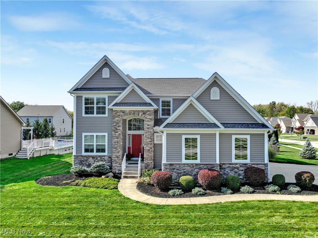 Welcome to this custom Kraftech-built colonial in the highly sought-after Melrose Farms subdivision of Willoughby. Set on nearly half an acre, this home offers over 3,200 square feet of living space with five bedrooms, three and a half baths, and a finished basement with a wet bar.

The two-story foyer sets a welcoming tone and leads into the open main level. The great room features a gas fireplace and plenty of natural light, flowing seamlessly into the eat-in kitchen. The kitchen includes upgraded countertops, a tile backsplash, stainless steel appliances, and a comfortable dining area that overlooks the backyard. Brand new carpet (installed October 2025) throughout adds a fresh touch.

Just off the main living space, a first-floor bedroom provides flexibility for a home office, playroom, or guest room. This level also includes a versatile laundry room (with hookups) that could also be used for additional storage or converted into a mudroom, depending on your needs.

Upstairs, the primary suite features a walk-in closet and a private bath with double vanity. Three additional bedrooms and another full bath complete the second floor, along with the main laundry room conveniently located nearby.

The lower level adds even more living space with a rec room, full bath and wet bar with a refrigerator. It’s the perfect spot for entertaining, a media room, and even a home gym.

Car enthusiasts will appreciate the attached three-car garage with elevated ceilings, offering space for a lift, workshop, or extra storage.

Outside, a patio overlooks the generous corner lot, offering room to relax, garden, or host gatherings.

Located in one of Willoughby’s most desirable neighborhoods, known for its beautiful homes and convenient location close to parks, golf, shopping, and highways.
